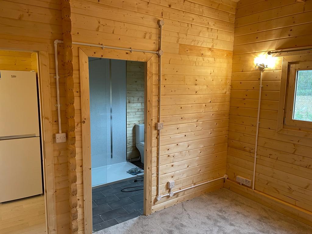 complete installation of electrical system in a log cabin